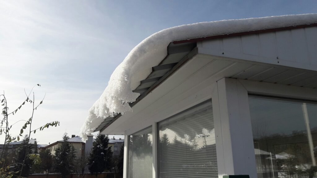 snow on metal roof
